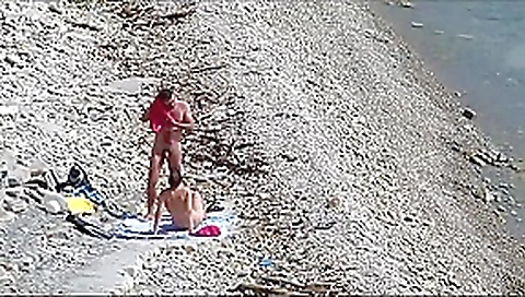 Couple fucked on a public beach while as people walked near Couple fucked on a public beach while as people walked near